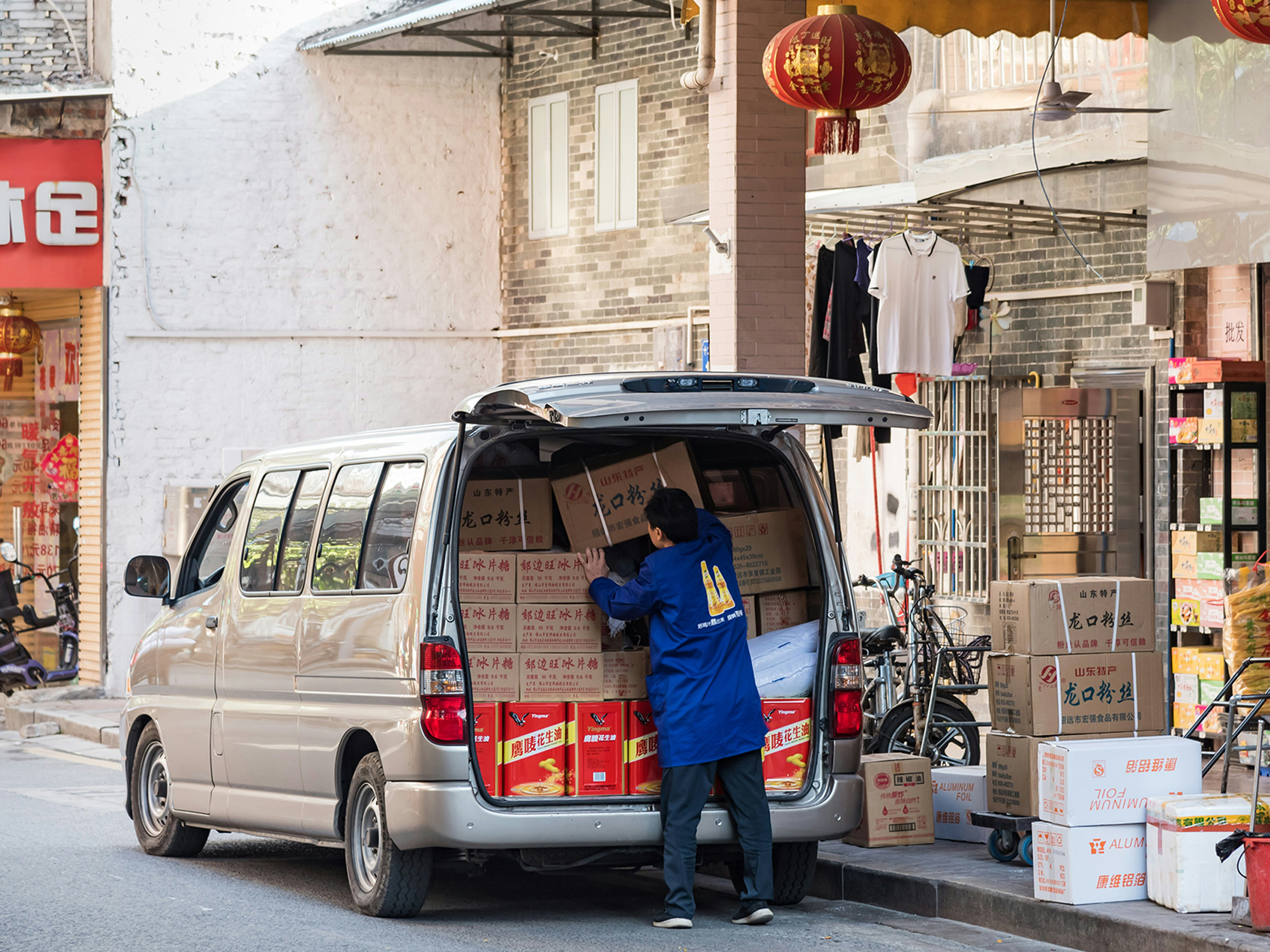 international location - man loading back of truck
